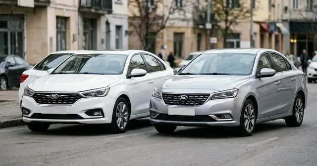 Белый седан Lada Vesta стоит рядом с серым Belgee S50 на парковке дилерского центра